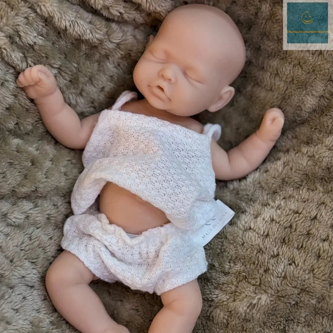 10Inch Sleeping Silicone bébé reborn Girl Doll With Painted Skin Full Body Silicone Lifelike Reborn Dolls lifelikesiliconereborns.com