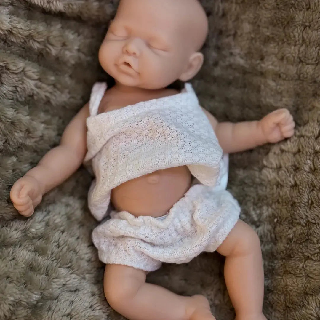 10Inch Sleeping Silicone bébé reborn Girl Doll With Painted Skin Full Body Silicone Lifelike Reborn Dolls lifelikesiliconereborns.com