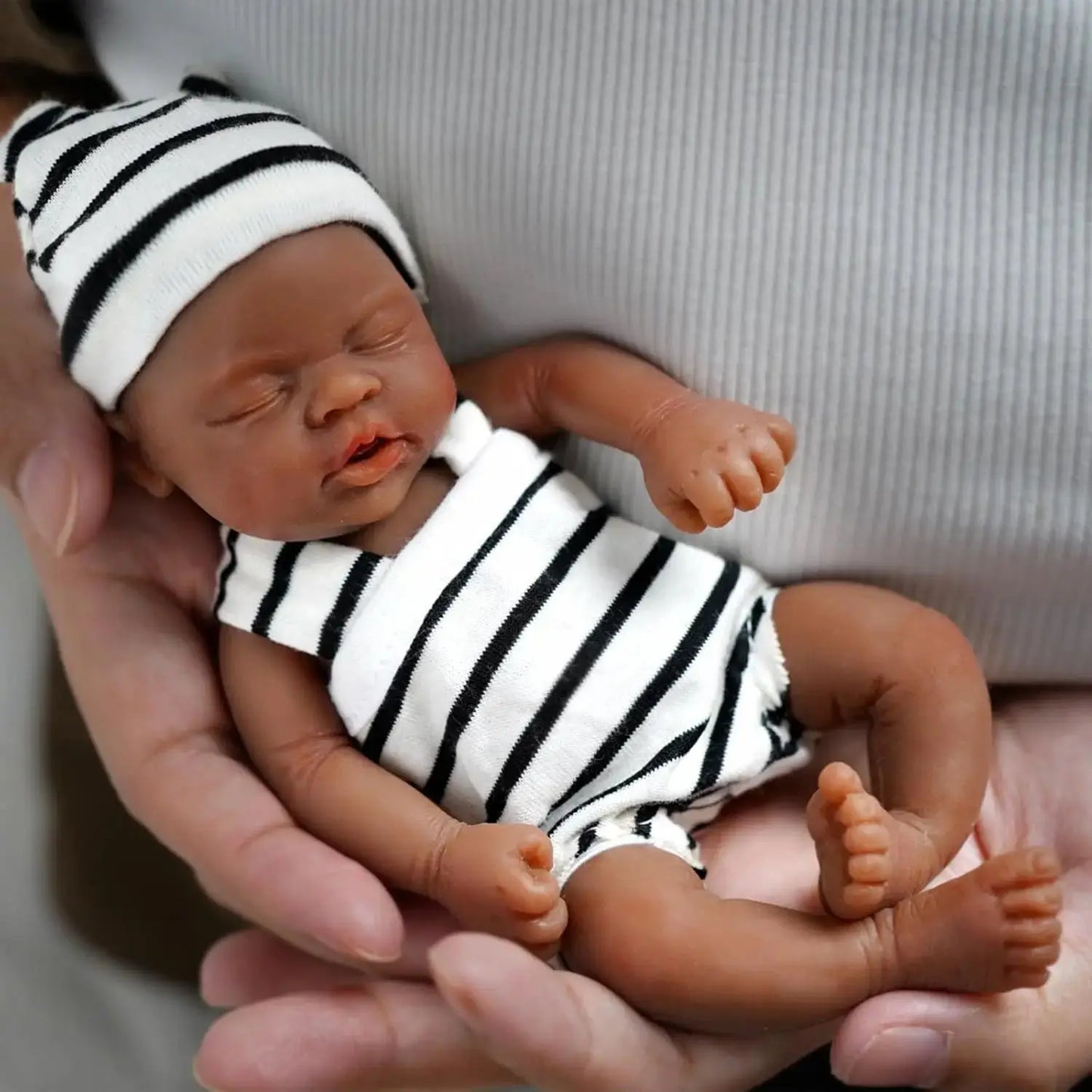Full Body Silicone Baby Reborn Doll 7 Inch Lifelike Sleeping Black Skin Girl with Toy Accessories for Kids Christmas Gift lifelikesiliconereborns.com